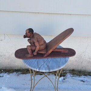 African Statue Man On Boat